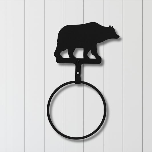 Towel ring with bear silhouette on a white wooden background