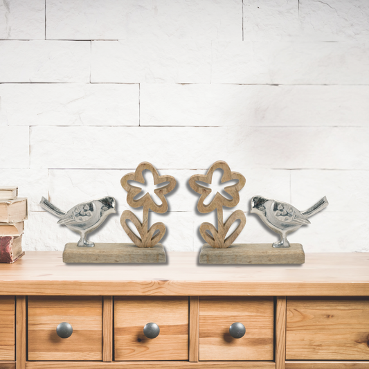 Silver-tone birds on wood bases with floral details, set of two, perfect for country cottage or boho-style decor.